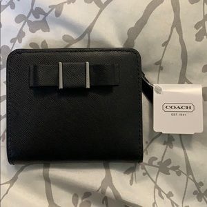 Black coach wallet with bow